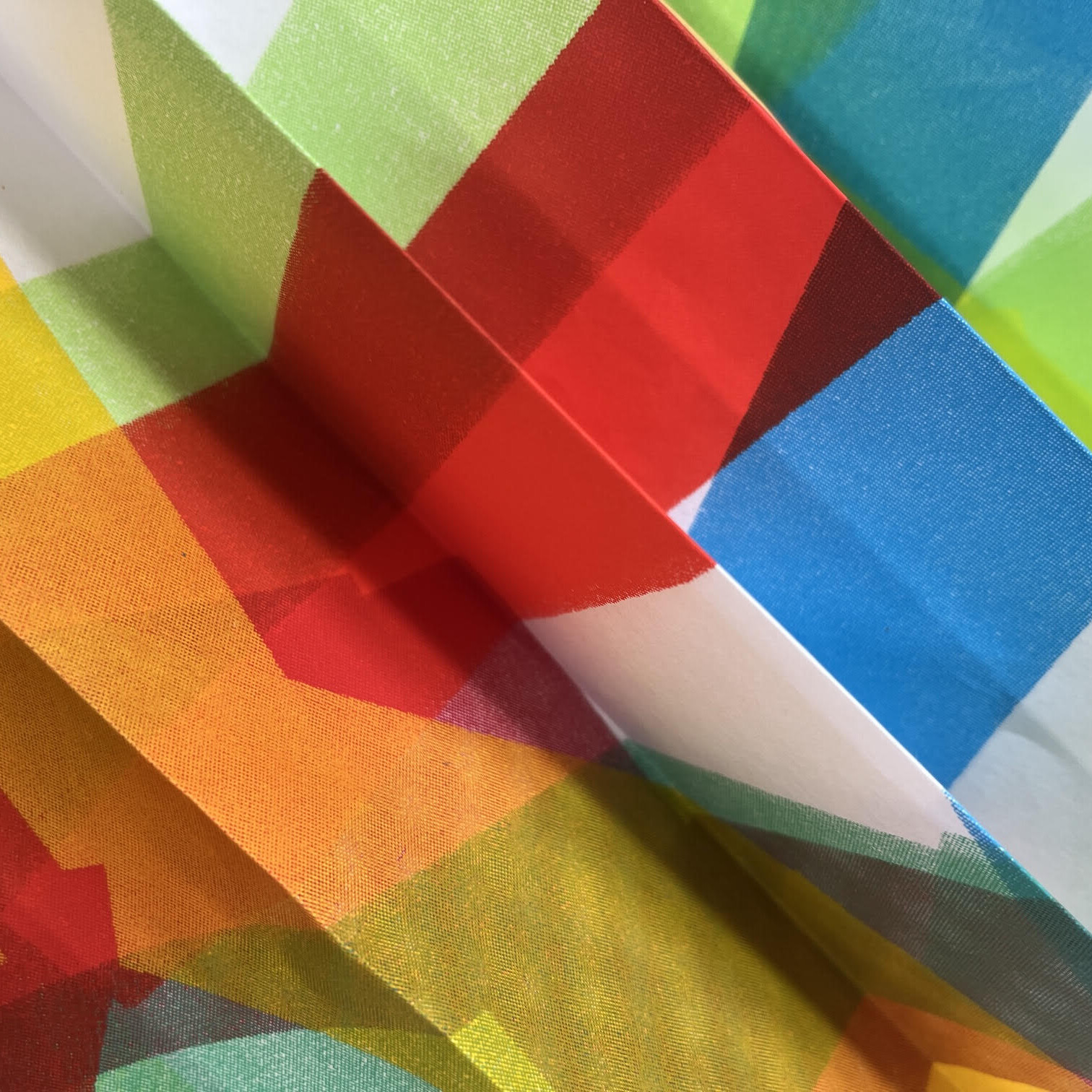 detail shot of colourful concertina'd paper