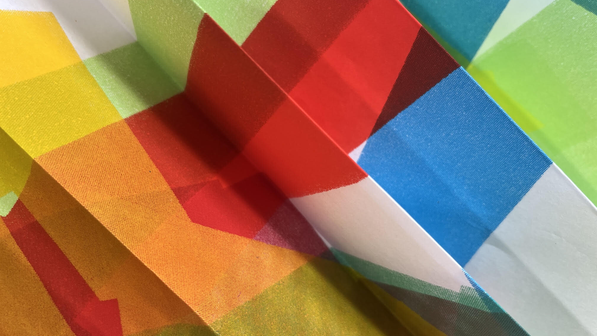 detail shot of colourful concertina'd paper